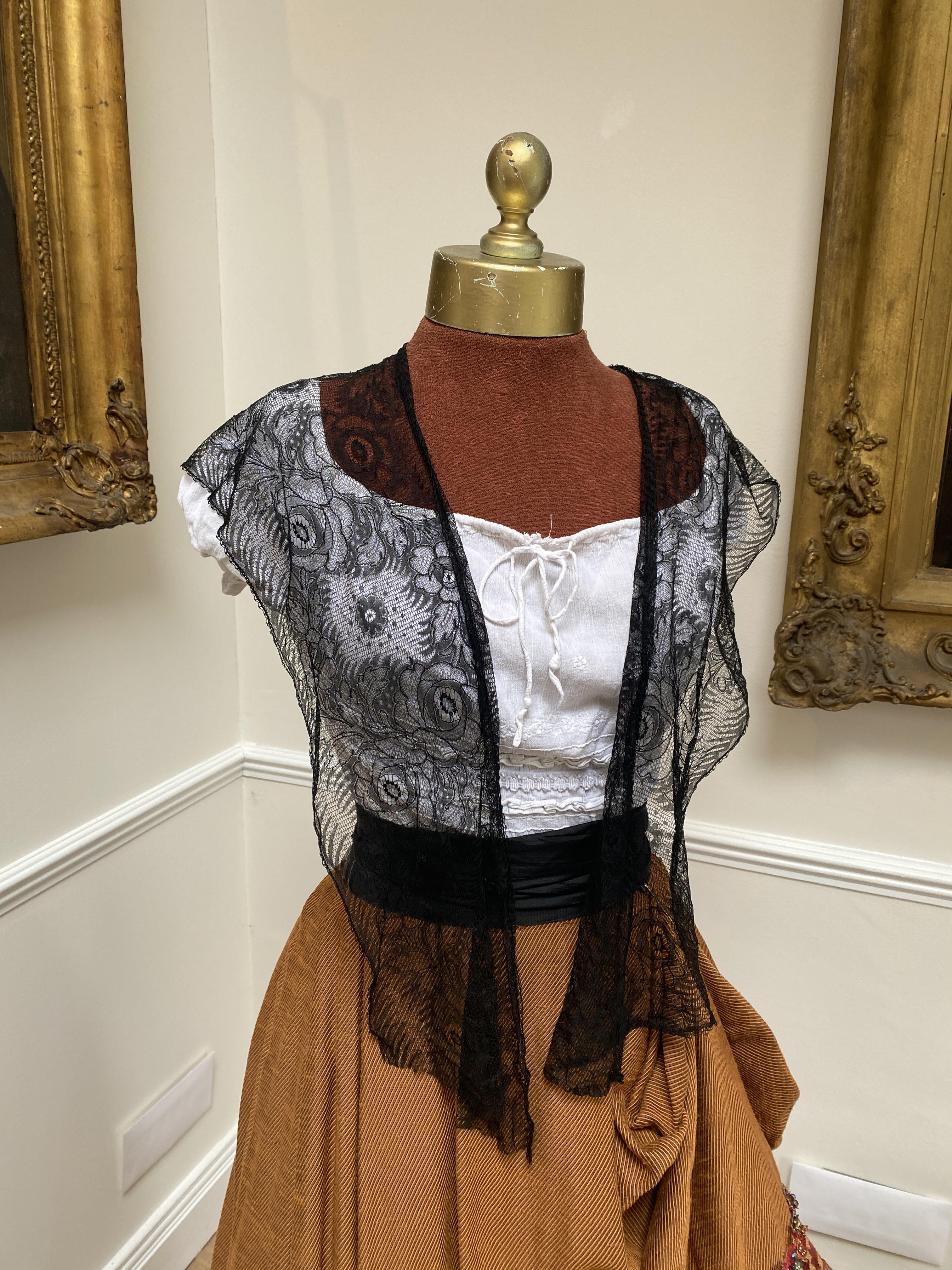 Carmen costume. A heavy embroidered skirt, and white cotton blouse, silk black waist sash and black lace shawl. Size 10 to 16